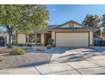 Charming single-story home with a well-maintained lawn and inviting facade in a residential neighborhood at 6225 Sadler Dr, Las Vegas, NV 89130