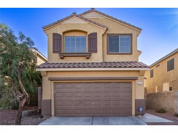 Charming two-story home featuring a two-car garage and a well-maintained front yard with desert landscaping at 6365 Diego Dr, Las Vegas, NV 89156
