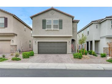 Charming home featuring a well-kept front yard and an attached two-car garage at 7006 Sylmar Ave, Las Vegas, NV 89113