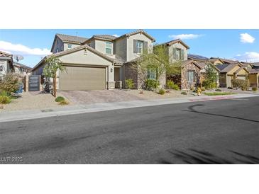Charming two-story home showcasing desert landscaping, stone accents, and a spacious two-car garage at 234 Polaris Ridge Ave, Henderson, NV 89011