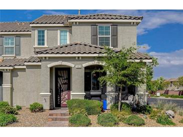 Charming two-story home with a well-maintained front yard and covered entry at 2853 Cabrillo Terrace St, Henderson, NV 89044