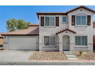 Charming two-story home featuring a two-car garage and well-maintained front yard landscaping at 5216 Aztec Heights St, North Las Vegas, NV 89081