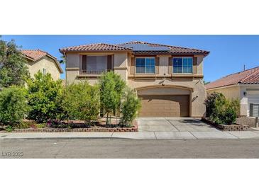 Charming two-story home with a tile roof, solar panels, and well-maintained landscaping at 6032 S Pioneer Way, Las Vegas, NV 89113