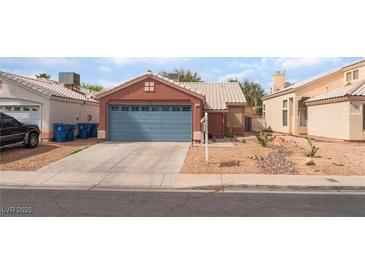 Charming single-story home with a well-maintained yard and a two-car garage and drought-resistant landscaping at 6056 Flowering Plum Ave, Las Vegas, NV 89142