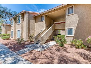 Inviting multi-story building with classic architectural details and well-maintained landscaping at 7200 Pirates Cove Rd # 2071, Las Vegas, NV 89145