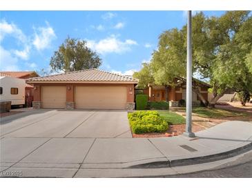 Charming single-story home with a well-manicured front yard, two-car garage, and inviting curb appeal at 7517 Elk Meadows Ct, Las Vegas, NV 89131