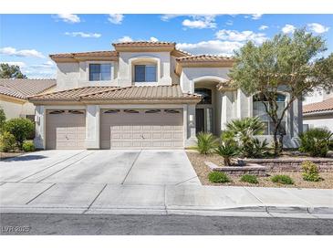 Inviting two-story home with a three-car garage, landscaped yard, and tile roof at 9916 Dusty Winds Ave, Las Vegas, NV 89117