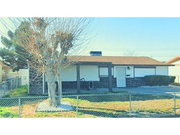 Charming single-story home featuring stone accents and a well-maintained front yard, perfect for suburban living at 2029 Lawry Ave, North Las Vegas, NV 89032