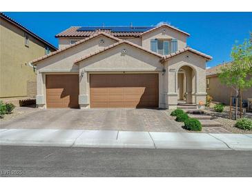Charming two-story home featuring a spacious three-car garage and desert landscaping for excellent curb appeal at 10172 Fire Skye Ave, Las Vegas, NV 89166