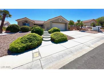 Charming one-story home with a well-manicured front yard and an inviting driveway at 11025 Hawk Valley Ave, Las Vegas, NV 89134