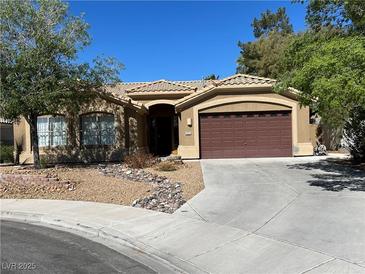Charming single-story home with desert landscaping, concrete driveway and covered porch at 1901 Rolling Dunes Ct, Las Vegas, NV 89117
