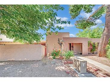 Charming single-story home with stucco exterior, desert landscaping and inviting front entryway at 4237 Brockton Green Ct, Las Vegas, NV 89110