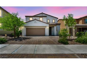 Charming two-story home with a paver driveway and well-maintained landscaping at 637 Our Heritage St, Henderson, NV 89011