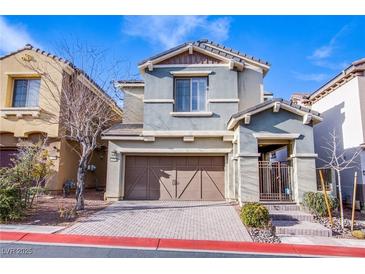 Charming two-story home with a well-manicured front yard and inviting curb appeal at 11242 Almador Vista Ct, Las Vegas, NV 89135