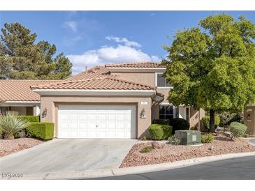 Inviting home with a two car garage, beautiful plants and desert landscaping at 1912 Summer Pine Ct # 103, Las Vegas, NV 89134