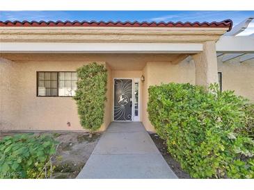 Inviting front entrance with decorative door and lush landscaping creating a welcoming curb appeal at 2851 S Valley View Blvd # 1026, Las Vegas, NV 89102