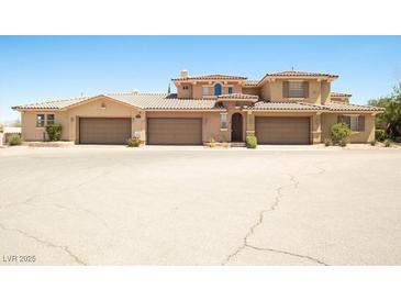 Charming multi-story home featuring a three-car garage and well-maintained desert landscaping at 31 Via Mantova # 1, Henderson, NV 89011