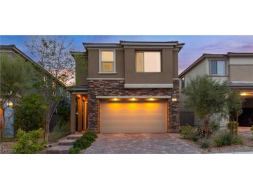 Inviting two-story home with brick accents and a spacious two-car garage at 397 Purple Sandpiper St, Las Vegas, NV 89138