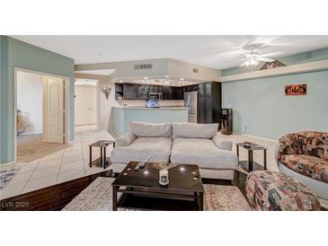Inviting living room flowing into an updated kitchen, perfect for modern living and entertaining guests at 6916 Dorita Ave # 101, Las Vegas, NV 89108