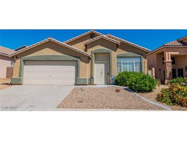 Charming single-story home featuring desert landscaping, a two-car garage, and a welcoming front entrance at 7990 Timber Horn Ct, Las Vegas, NV 89147