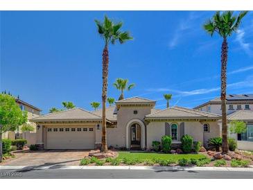 Charming single-story home with desert landscaping, arched entry, and a spacious three-car garage at 3614 Coventry Gardens Dr, Las Vegas, NV 89135