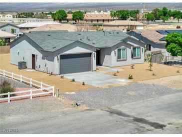 Charming single-story home featuring a two-car garage and low-maintenance landscaping at 790 Lone Pine Rd, Pahrump, NV 89048