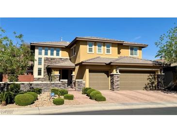Charming two-story home featuring a two-car garage, stone accents, and manicured landscaping at , Las Vegas, NV 89135