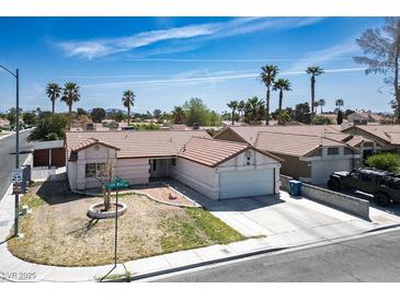 Charming single-story home with a well-maintained yard and a two-car garage, located in a serene neighborhood at 3016 Light Wind Ct, Las Vegas, NV 89108