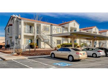 Well-maintained condo building with covered parking and easy access to upper units via exterior stairs at 3318 N Decatur Blvd # 2073, Las Vegas, NV 89130
