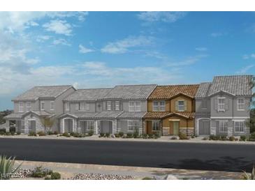New townhomes are featured with neutral exteriors, complemented by desert landscaping and clear blue skies at 3632 Stoppani Ave, Henderson, NV 89044