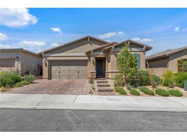 Charming single-story home with a well-manicured lawn and inviting curb appeal at 713 Webber Park St, Henderson, NV 89011