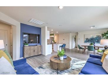 Bright living room boasts modern decor, stylish furnishings, and an open floor plan at 7920 Pandora Sky St # 281, North Las Vegas, NV 89084
