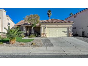 Charming single-story home featuring a tile roof, desert landscaping, and an attached two-car garage at 8962 Shale Valley St, Las Vegas, NV 89123