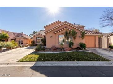 Charming single-Gathering home with a well-manicured lawn and a two-car garage at 2143 Vista Famosa Ct, Las Vegas, NV 89123