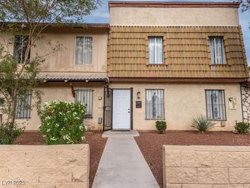 Charming two-story townhome with well-maintained landscaping and inviting entrance at 3934 Palos Verdes St, Las Vegas, NV 89119