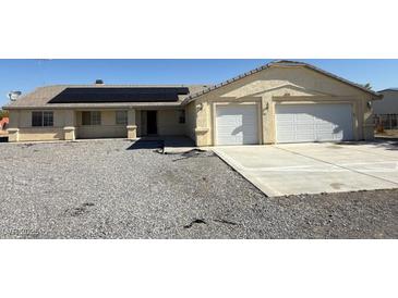 Charming single-story home featuring desert landscaping and a two-car garage at 4330 Turner Blvd, Pahrump, NV 89061