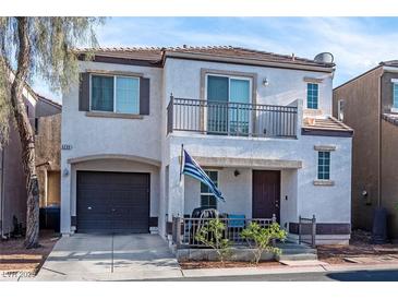 Charming two-story home featuring a balcony, cozy porch and an attached garage in a well-maintained neighborhood at 6299 Oread Ave, Las Vegas, NV 89139