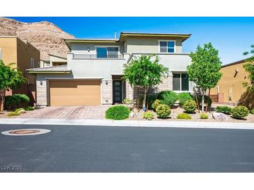 Modern two-story home featuring a two-car garage and well-maintained landscaping at 6433 Farness St, Las Vegas, NV 89135