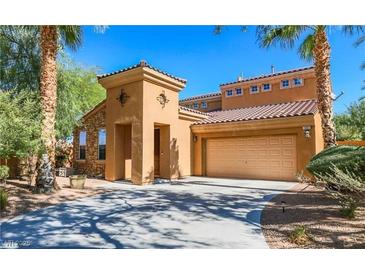 Inviting two-story home with a two-car garage, stylish stone accents, and well-manicured landscaping at 1091 Casa Palermo Cir, Henderson, NV 89011