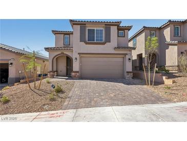 Charming two-story home featuring an attached garage and a beautifully paved driveway at 10933 Sageview Ave, Las Vegas, NV 89166