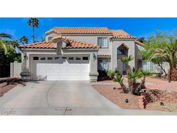 Charming two-story home featuring a terracotta roof, stucco siding, and a well-maintained front yard at 5 Tarryall Ter, Henderson, NV 89074