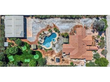 Stunning aerial view of estate with a custom pool, putting green, and extensive parking at 7760 Haven St, Las Vegas, NV 89123
