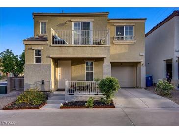 Charming two-story home featuring a small front yard and balcony at 9157 Acclamation Ct, Las Vegas, NV 89149