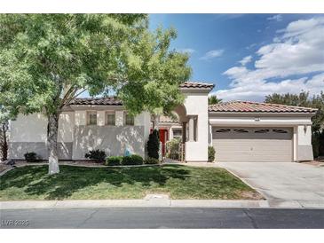 Charming single-story home with well-manicured lawn, mature trees, and a tile roof at 1116 Piazza Telle, Henderson, NV 89052