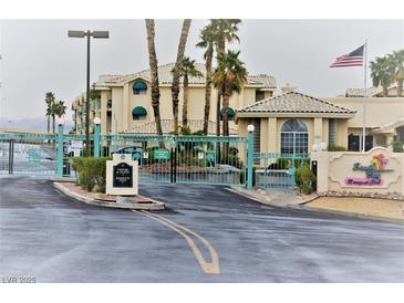 Inviting gated community entrance with lush landscaping and charming architectural details at 3550 Bay Sands Dr # 3001, Laughlin, NV 89029