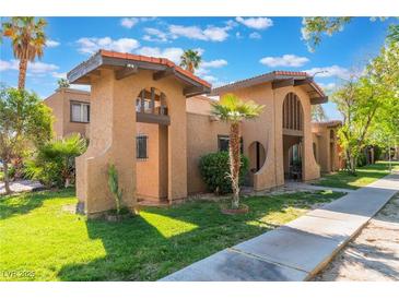 Charming exterior view showcasing the property's unique architecture and well-maintained landscaping at 4687 Monterey Cir # 1, Las Vegas, NV 89169
