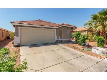 Charming single-story home featuring a tile roof, two-car garage, and well-maintained landscaping at 6489 Coldwater Bay Dr, Las Vegas, NV 89122