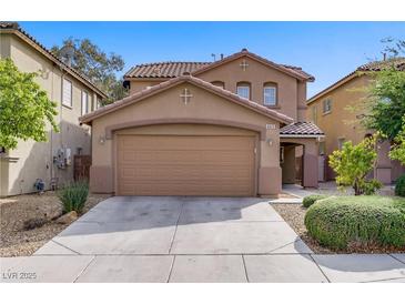 Charming two-story home with a two-car garage and desert landscaping for easy maintenance at 6625 Pine Siskin Pl, North Las Vegas, NV 89084