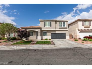 Charming two-story home featuring a well-manicured front yard and attached two-car garage at 2418 Brockton Way, Henderson, NV 89074