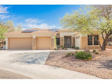 Charming single-story home with three-car garage, desert landscaping, and solar panels at 3004 Canton Hills St, Henderson, NV 89052